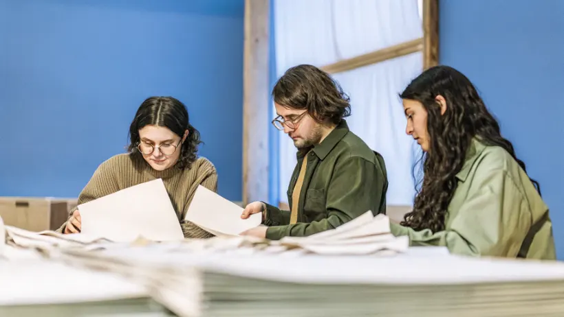 Students working together analyzing documents and making decisions